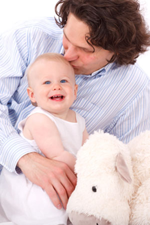 Dad Kissing Baby